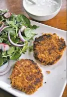  ?? Gretchen McKay/Post-Gazette ?? Deviled Salmon Cakes are served with Lemon Yogurt Sauce.