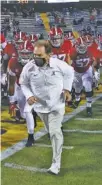  ?? ALABAMA PHOTO/ KENT GIDLEY ?? Alabama football coach Nick Saban leads the Crimson Tide on the field before last Saturday’s 55-17 win at LSU.