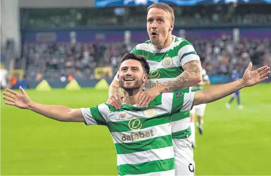  ?? Picture: SNS Group. ?? Leigh Griffiths congratula­tes Patrick Roberts after his deflected shot made it 2-0 for Celtic.