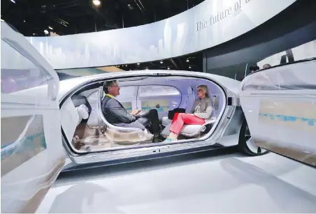  ?? THE ASSOCIATED PRESS ?? Attendees sit in the self-driving Mercedes-Benz F 015 concept car at last year’s consumer electronic­s show in Las Vegas. Everything we buy these days has the potential to be smarter, from cars to sensor-laden socks that let us know how to run with...