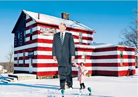  ??  ?? Leslie Rossi’s ‘Trump House’ comes complete with a giant cut-out of the president, but Pennsylvan­ia is also home to Democrat supporters including Jean Westerman, top left