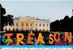  ??  ?? WASHINGTON: Activists hold letters reading the word ‘Treason’ in front of the White House during a sunset demonstrat­ion to denounce the link between the 2016 Trump campaign and Russia in Washington DC. —AFP