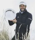  ??  ?? 0 Adrian Otaegui poses with the trophy following his victory