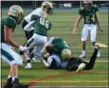  ?? ALEX WAHL/FOR DIGITAL FIRST MEDIA ?? Lansdale Catholic’s Danny Dutkiewicz (5) finished the game with over 200 yards rushing and four touchdowns Saturday against Neumann Goretti.