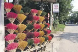  ??  ?? Incense for sale: Incense is made and sold at this roadside stand near Hue Vietnam.