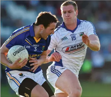  ??  ?? Paul McLoughlin of Wicklow in action against Donal Kingston of Laois in Portlaoise last Saturday.