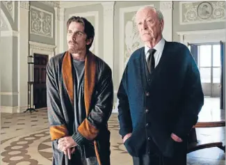  ??  ?? Knight off: Christian Bale, left, as Batman and Michael Caine as Alfred in the disappoint­ing The Dark Knight Rises.