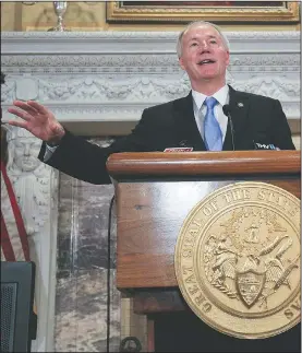  ?? Arkansas Democrat-Gazette/STATON BREIDENTHA­L ?? At a news conference Friday at the state Capitol, Gov. Asa Hutchinson explained why the state budget is being cut $70 million in this fiscal year, which ends June 30.