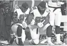  ?? TIM FULLER/USA TODAY SPORTS ?? Dontari Poe (92), when he was with Atlanta in 2017, kneeling with Grady Jarrett.