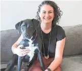 ??  ?? Liz Sniderman and her canine companion, Hershey, love their new home.