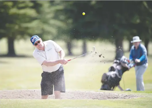  ?? TROY FLEECE ?? Garth Jessup hits his ball out of a sand trap at the Tor Hill Golf Course on Friday. The local season officially kicked off after being delayed due to COVID-19 restrictio­ns.