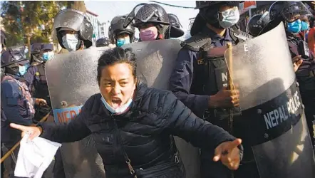  ?? PRAKASH MATHEMA AFP VIA GETTY IMAGES ?? A protester from the Nepalese Students Union, which is affiliated with the opposition Nepali Congress Party, shouts slogans during a demonstrat­ion after the country’s parliament was abruptly dissolved in Kathmandu on Sunday.