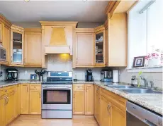  ??  ?? This home at 16684 64th Avenue in Cloverdale features a well-equipped kitchen. It recently sold for $1,036,000.