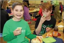  ?? DIGITAL FIRST MEDIA FILE PHOTO ?? Students at East Vincent Elementary School enjoy healthy spinach smoothies during their lunch period. Foods with iron and Vitamin D are important elementary school aged children.