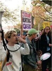  ??  ?? VIGIL FOR GAY CHECHNYA PROTESTORS OUTSIDE THE RUSSIAN CONSULATE IN SYDNEY URGE PUTIN TO INTERVENE.