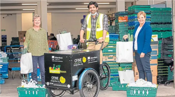  ??  ?? MEALS ON WHEELS: From left are Fiona Rae, Kevin Mathew and Michelle Handforth with the electric bike which will also enable the charity to reduce its carbon footprint
