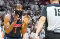  ?? AP Photo/Marta Lavandier ?? Philadelph­ia 76ers guard James Harden (1) reacts to a call by referee Zach Zarba (15) Wednesday during the second half of Game 2 of an NBA basketball second-round playoff series against the Miami Heat in Miami.