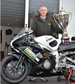  ?? ?? Dean Ratcliff with his 600cc Yamaha R6 and the impressive trophy