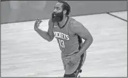  ?? Associated Press ?? New start for Harden: James Harden of the Houston Rockets reacts to a basket during the first quarter of an NBA basketball game Sunday in Houston, Texas.