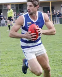  ??  ?? Neerim-Neerim South’s Chris Urie looks downfield for a passing option.