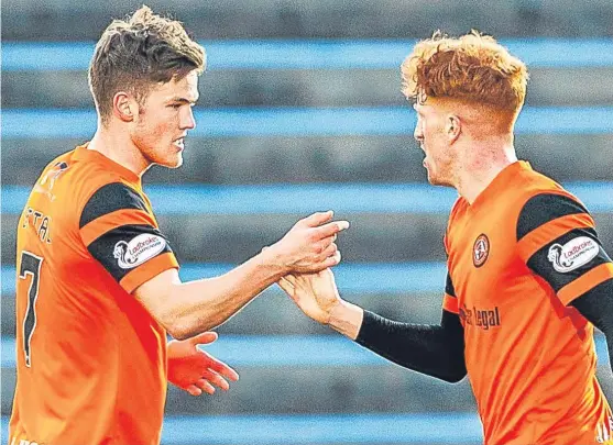  ?? Picture: SNS Group. ?? United scorers Blair Spittal, left, and Simon Murray celebrate after the second goal.