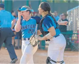  ?? GORDON RADFORD/COURTESY ?? Coral Springs Emily Estroff, left, and Christina Arcos celebrate their Class 5A softball championsh­ip on Wednesday in Vero Beach.