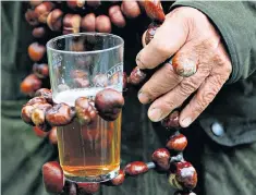  ??  ?? Hard nut: a beer glass holder made out of conkers at the 2013 world championsh­ips