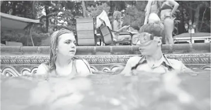  ??  ?? Kayla (Elsie Fisher) befriends Gabe (Jake Ryan) at the pool party from hell in “Eighth Grade,” in theaters Friday.