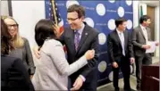  ?? AP ?? Washington Attorney General Bob Ferguson (center) thanks staff members after a news conference about a federal appeals court’s refusal to reinstate US President Donald Trump’s ban on travelers from seven predominan­tly Muslim nations on Thursday in...