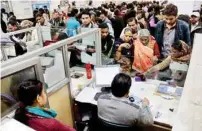  ?? PTI ?? People stand in long queues in Allahabad on Thursday