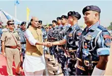  ??  ?? Home Minister Rajnath Singhr meeting RAF jawans during the Silver Jubilee Parade of the Rapid Action Force (RAF) in Meerut on Saturday.