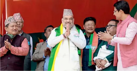  ?? ANI ?? Union Home Minister Amit Shah greets during an election campaign rally in Darjeeling, West Bengal, on Tuesday. —