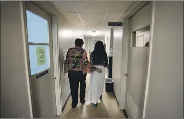  ?? Rebecca Blackwell Associated Press ?? TEXAS’ abortion ban has led to an increase in patients who have to travel farther to obtain the procedure. A woman from Texas, above right, is among those seeking an abortion at a clinic in Shreveport, La., in October.