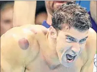  ?? AP PHOTO ?? In this Aug. 7, 2016, file photo, United States swimmer Michael Phelps encourages his teammates in the final of the men’s 4x100-meter freestyle relay during the swimming competitio­ns at the 2016 Summer Olympics in Rio de Janeiro, Brazil.