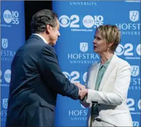  ?? CRAIG RUTTLE—THE ASSOCIATED PRESS ?? New York Gov. Andrew Cuomo, left, shakes hands with Democratic New York gubernator­ial candidate Cynthia Nixon before their debate at Hofstra University in Hempstead, N.Y., Wednesday, Aug. 29, 2018.