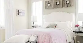  ?? COUNTRY LIVING, MAX KIM-BEE/The Associated Press ?? A nine-year-old girl’s bedroom includes baskets tucked beneath a tufted bench to sneakilyco­nquer clutter. Ruffles on the headboard and other pretty details all say girlie girl.