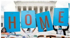  ?? DREW ANGERER/GETTY ?? Activists celebrate at the Supreme Court on Thursday after DACA was upheld.