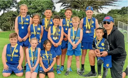  ?? JARED NICOLL ?? Titahi Bay Athletics Club members, back from left, Caitin Moore, Tamara Pickering, Nelsson Tiumalu, Anton Ford-Tuveve, Dante Ford-Tuveve, Ashton Hamer, Tyrone Resch, and AJ Tiumalu with his dad. Kneeling, Jakob Moore, Ayla Hamer and Prayer Edmonds.