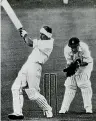  ??  ?? A bandage-swathed Bert Sutcliffe bats in the memorable test against South Africa at Johannesbu­rg.