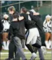  ?? TONY AVELAR — THE ASSOCIATED PRESS ?? Oakland QB Derek Carr (4) is helped off during the second half against the Colts in Oakland Saturday.