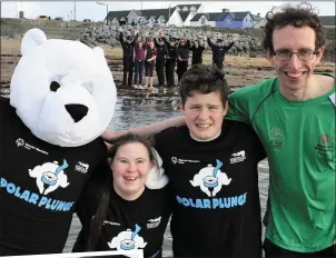  ?? ABOVE: LEFT: ?? Mascot ‘Bear Chills’ braves the water at Fenit Beach with Special Olympics athletes Mary Claire McCarthy, Jonathan Kerins and Brendan O’Connell for the launch of Kerry’s first Polar Plunge on December 9 while
Swimmer Mary Claire McCarthy (Currow,...