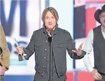 ??  ?? Keith Urban accepts the Entertaine­r of the Year award onstage during the 54th Academy Of Country Music Awards at MGM Grand Garden Arena on Sunday in Las Vegas, Nevada. — AFP photos