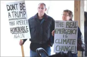  ?? PETE BANNAN - MEDIANEWS GROUP ?? Frederick Stluka and Brita Van Rossum of Malven attend the national day of protest against the border emergency that President Donald Trump enacted Friday. The event was held in the Veterans Memorial Pavilion at East Goshen Township Park on Monday.