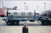  ?? AP FILE ?? A submarine missile is paraded across the Kim Il Sung Square during a military parade, in Pyongyang on April 15, 2017.