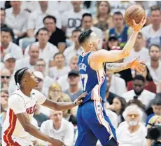  ?? JOE SKIPPER/AP ?? Philadelph­ia 76ers guard JJ Redick (17) shoots in the fourth quarter as Miami Heat forward Josh Richardson (0) trails too late on the play in Saturday’s Game 4.