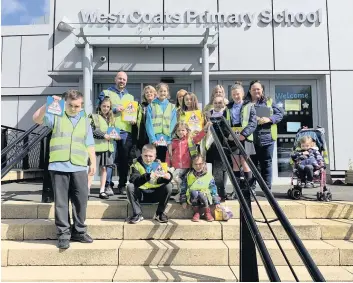  ??  ?? Safety first West Coats Primary pupils and parent council members get the message out