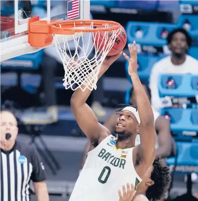  ?? MICHAEL CONROY/AP ?? Baylor forward Flo Thamba shoots against Villanova in the second half of a Sweet 16 game Saturday at Hinkle Fieldhouse in Indianapol­is. AllAmerica­n junior Jared Butler and his backcourt mates Davion Mitchell and MaCio Teague get all of the attention.