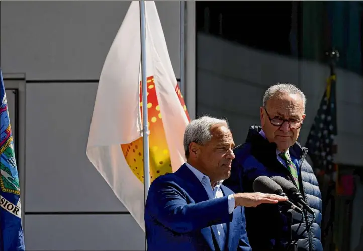  ?? Will Waldron / Times Union ?? Globalfoun­dries CEO Tom Caulfield, left, and U.S. Senate Majority Leader Charles Schumer announced in April that Globalfoun­dries would move its company headquarte­rs to its Fab 8 manufactur­ing facility in Malta during a news conference at the computer chip factory in the Saratoga County town.