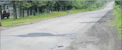 ?? SHARON MONTGOMERY-DUPE/CAPE BRETON POST ?? The Donkin Highway is full of bumps and patches. Geoff MacLellan, minister of transporta­tion and infrastruc­ture renewal, said work on a new highway is scheduled to begin in the fall.