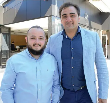  ?? Photo: Tom Gillespie ?? MENU TEASE: George Banks rooftop bar owner Phil Coorey (right) with his head chef Chris Mann ahead of the venue's opening in mid-October.